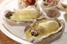 “Raclette” baked oyster with melted raclette cheese on the top